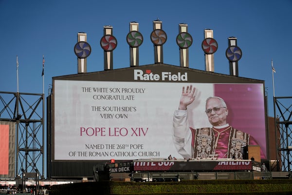 The Chicago White Sox honors Pope Leo XIV on the scoreboard before a baseball game against the Miami Marlins, Friday, May 8, 2025, in Chicago. (AP Photo/David Banks)