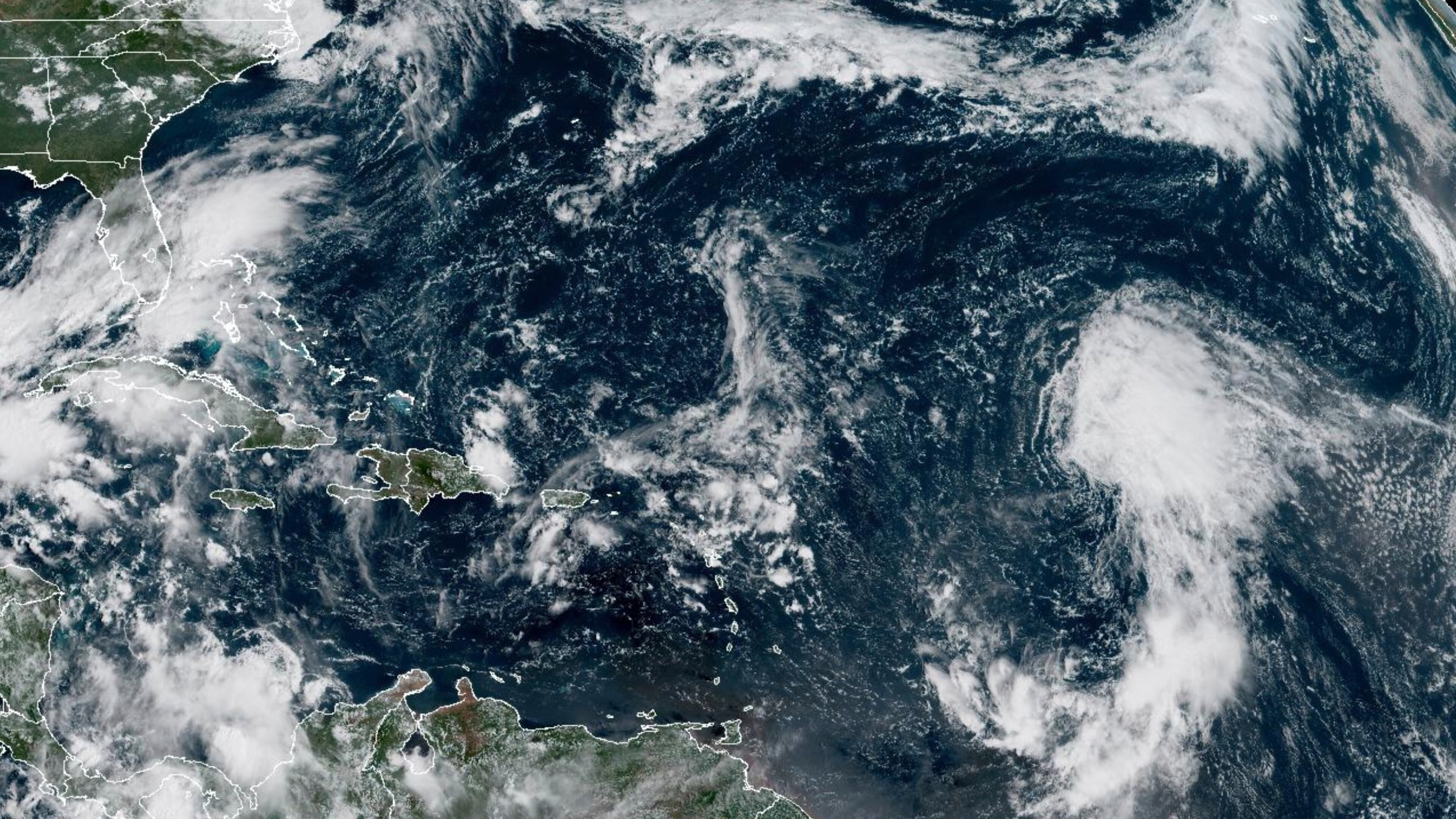 This GOES-19 GeoColor satellite image taken Wednesday, Sept. 17, 2025 at 10:50 a.m. EDT, and provided by NOAA, shows Tropical Storm Gabrielle, right, in the tropical Atlantic Ocean. (NOAA via AP)
