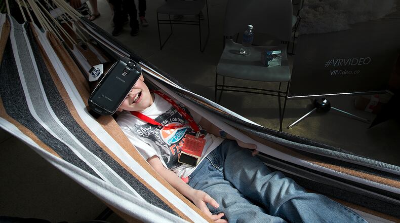 Draven Borchardt, 10, tries out a virtual reality tour of Costa Rica at the VR Video booth at Sx Create at the Long Center on Sunday, March 15, 2015. This free SXSW event highlighted new technology and science based activities. DEBORAH CANNON / AMERICAN-STATESMAN