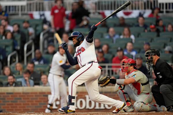 Atlanta Braves outfield Bryan De La Cruz (14) hits a single against the Philadelphia Phillies in the second inning of a baseball game, Wednesday, April 9, 2025, in Atlanta. (AP Photo/Mike Stewart)