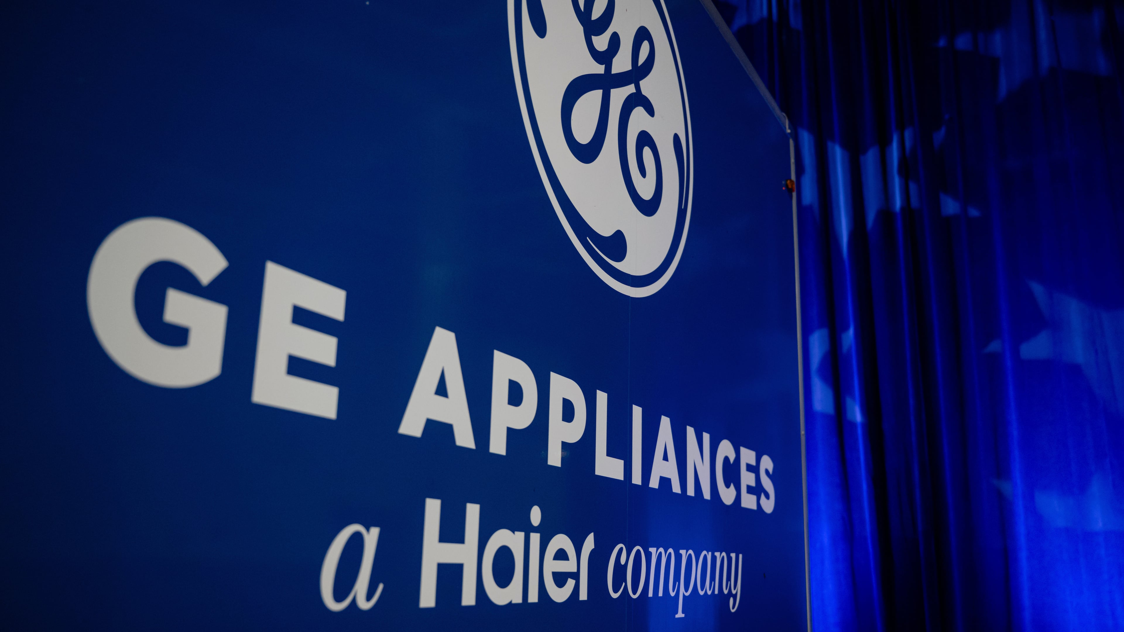 FILE - A trailer with the GE logo is seen at a stage area at GE Appliances global headquarters, Aug 13, 2025, in Louisville, Ky. (AP Photo/Jon Cherry, file)