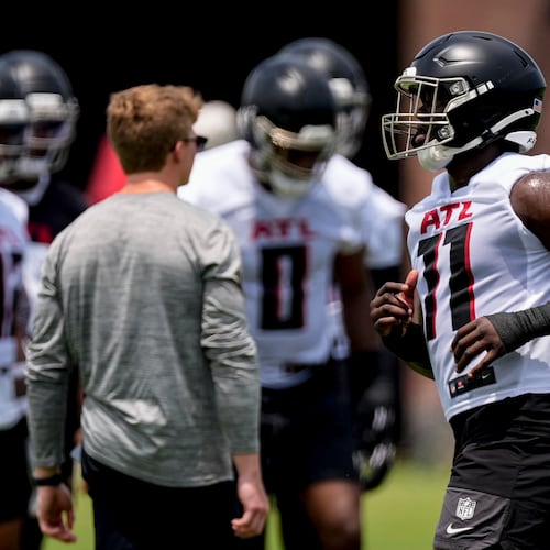 Atlanta Falcons linebacker Jalon Walker (11) works out during the final day of mandatory minicamp Wednesday in Flowery Branch. Walker’s infectious personality, as described by outside linebackers coach Jacquies Smith, was apparent during the option portion of practice. (Mike Stewart/AP)