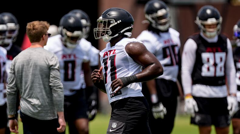 Atlanta Falcons linebacker Jalon Walker (11) works out during practice at NFL football minicamp, Wednesday, June 11, 2025, in Flowery Branch, Ga. (AP Photo/Mike Stewart)