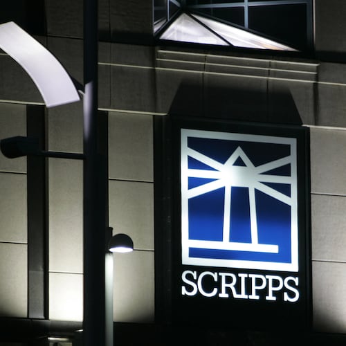 FILE - Floodlights light up the E.W. Scripps logo on the company's headquarters in Cincinnati, Jan. 31, 2006. (AP Photo/Al Behrman, File)