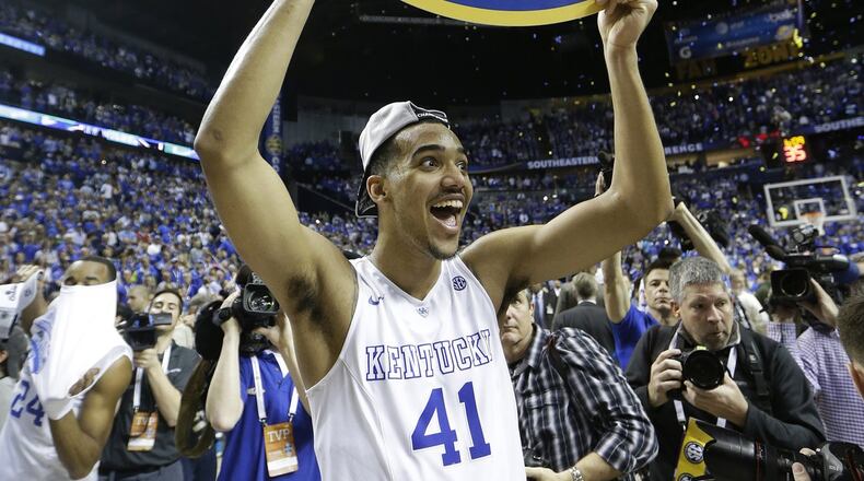 Kentucky forward Trey Lyles holds a sign after tSoutheastern Conference championship game against Arkansas. Kentucky won 78-63. (AP Photo/Mark Humphrey)