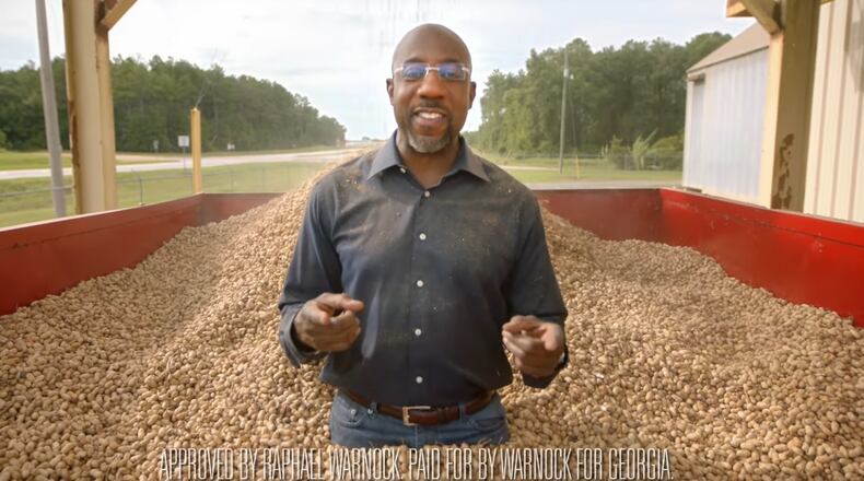 In a campaign ad aimed at showcasing Raphael Warnock's bipartisan work on behalf of Georgia's peanut farmers, he was showered with thousands of peanuts.
