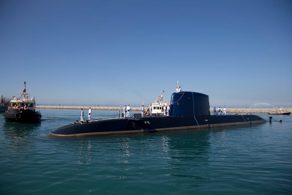FILE - An Israeli navy sailors stand atop a submarine "Rahav" upon its arrival in to the military port in Haifa, Israel, on Jan. 12, 2016. (AP Photo/Ariel Schalit, File)