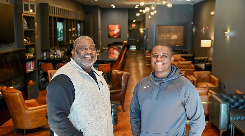 Bruce Riggins, left, owner of Churchills on Cherry, and his son Nicholas Riggins (Photo Courtesy of Jason Vorhees/The Telegraph)