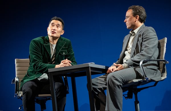 This image released by Polk & Co. shows Daniel Dae Kim, left, and Greg Keller during a performance of "Yellow Face on Broadway," a play by David Henry Hwang, in New York. (Joan Marcus/Polk & Co. via AP)
