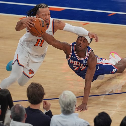 Philadelphia 76ers' Vj Edgecombe, right, fouls New York Knicks' Jalen Brunson during the first half of Game 1 in a second-round NBA basketball playoffs series Monday, May 4, 2026, in New York. (AP Photo/Seth Wenig)
