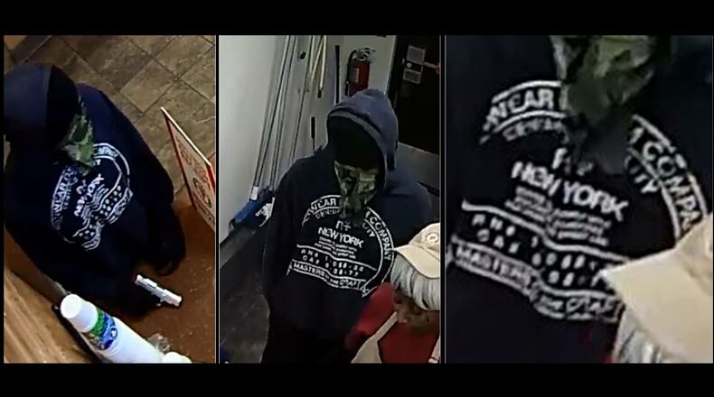 Gwinnett County police are searching for this man, who is alleged to have robbed a Peachtree Corners Popeye's restaurant at gunpoint.