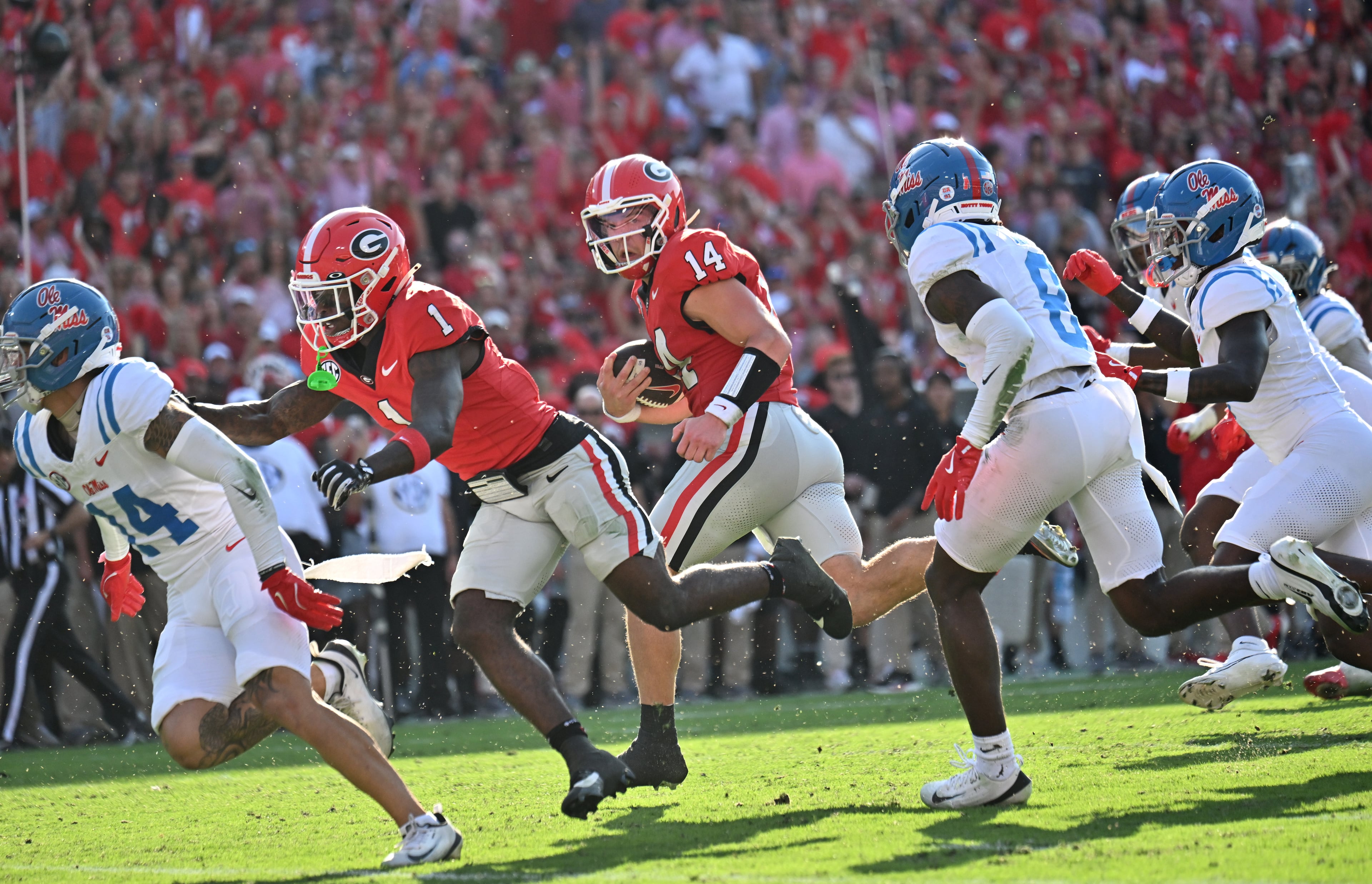 Georgia quarterback Gunner Stockton (14) runs for a touchdown catch during the first half in an NCAA football game at Sanford Stadium, Saturday, October 18, 2025, in Athens. (Hyosub Shin / AJC)