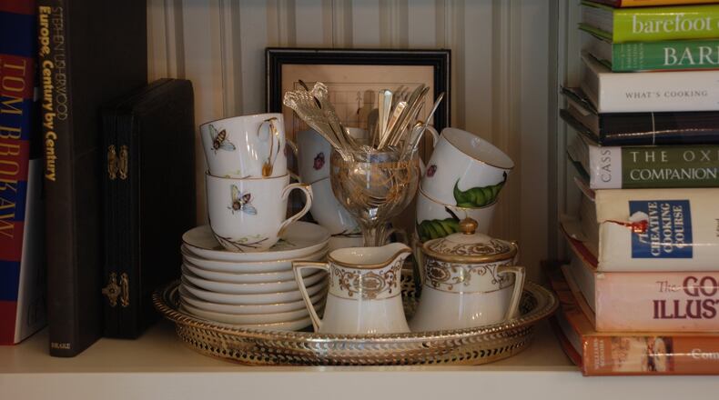 A tray makes this shelf not only functional, but also visually appealing. (Mary Carol Garrity/TNS)
