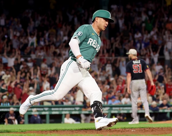 Boston Red Sox's Rob Refsnyder rounds first base after hitting a home run during the seventh inning of a baseball game against the Atlanta Braves, Friday, May 16, 2025, in Boston. (AP Photo/Mark Stockwell)