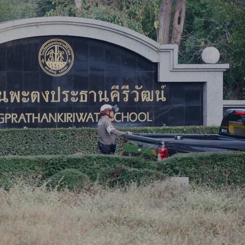 A Thai policeman stands outside Patongrathankiriwt school at Hat Yai, southern Thailand, Wednesday, Feb. 11, 2026. (AP Photo/Sumeth Panpetch)