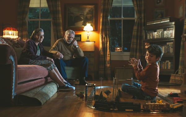 This image released by Neon shows Mia Sara, from left, Mark Hamill, and Cody Flanagan in a scene from "The Life of Chuck." (Neon via AP)
