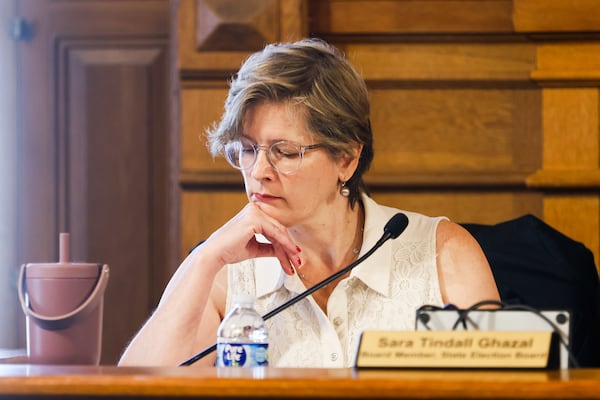 Board Member Sara Tindall Ghazal reads during a session as the State Election Board considers investigations of election fraud and misbehavior at the Georgia State Capitol in Atlanta on Tuesday, July 29, 2025. (Abbey Cutrer/AJC)
