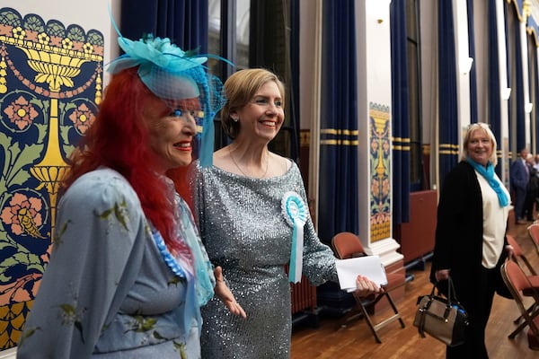 Reform U.K.'s Greater Lincolnshire mayoral candidate Dame Andrea Jenkyns, center, gestures during the count at Grimsby Town Hall, in Lincolnshire, England, for the Greater Lincolnshire Mayor election, Friday, May 2, 2025. (Joe Giddens/PA via AP)