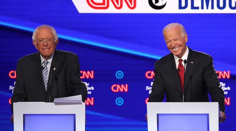 WESTERVILLE, OHIO - OCTOBER 15: Sen. Bernie Sanders (I-VT) and former Vice President Joe Biden react during the Democratic Presidential Debate at Otterbein University on October 15, 2019 in Westerville, Ohio. A record 12 presidential hopefuls are participating in the debate hosted by CNN and The New York Times. (Photo by Win McNamee/Getty Images)