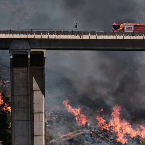 A firefighter truck next to a wildfire in Los Gallardos, near Almeria, Spain, Friday, July 10, 2026. (AP Photo/Gregorio Marrero)