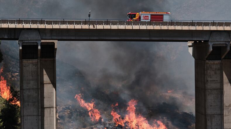 A firefighter truck next to a wildfire in Los Gallardos, near Almeria, Spain, Friday, July 10, 2026. (AP Photo/Gregorio Marrero)