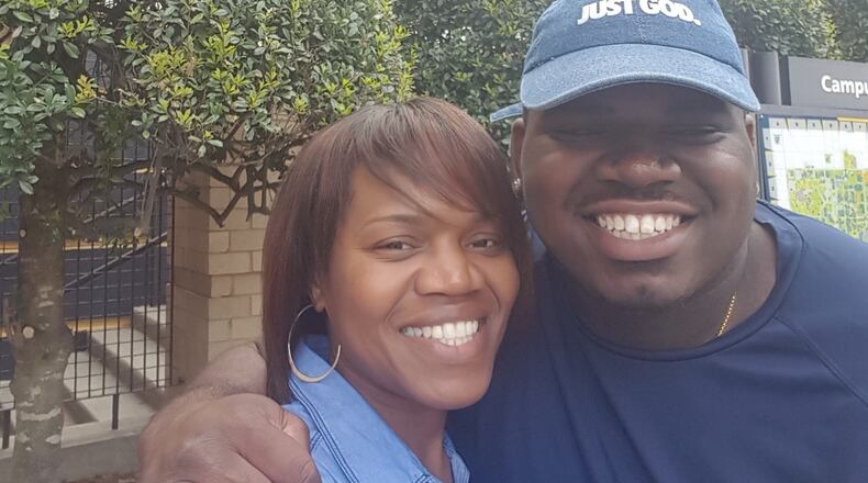 Brandon Adams posing with his mother Lisa Greer. Adams "always thought of ways of how he could make the world a better place and imprint himself upon the world," Greer said, "so that when he was no longer here, the world would recognize that he had been here." (Photo courtesy Lisa Greer)