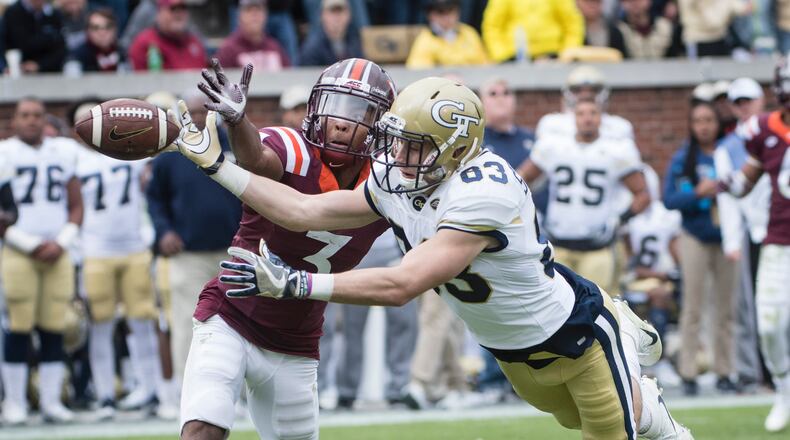Georgia Tech wide receiver Brad Stewart (83) and Virginia Tech cornerback Greg Stroman (3) vie to catch a pass during the first half of a football game on Saturday, Nov.11, 2017, in Atlanta. (Photo/John Amis)