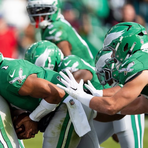 FILE - Philadelphia Eagles quarterback Jalen Hurts runs the "tush push" play during an NFL football game against the New York Giants, Oct. 26, 2025, in Philadelphia. (AP Photo/Chris Szagola, File)