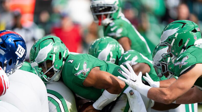 FILE - Philadelphia Eagles quarterback Jalen Hurts runs the "tush push" play during an NFL football game against the New York Giants, Oct. 26, 2025, in Philadelphia. (AP Photo/Chris Szagola, File)