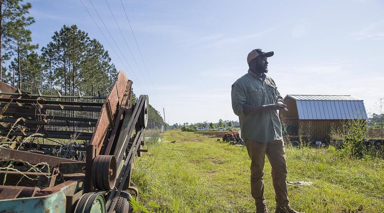 Farmer Sedrick Rowe talks farming at a 10-acre property he is leasing to own in Albany. (ALYSSA POINTER/ALYSSA.POINTER@AJC.COM)