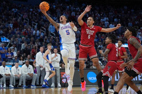 Florida guard Will Richard shoots past Texas Tech forward Darrion Williams, left, during the second half in the Elite Eight of the NCAA college basketball tournament, Saturday, March 29, 2025, in San Francisco. (AP Photo/Marcio Jose Sanchez)