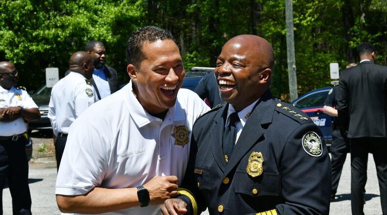 April 15, 2022 Atlanta - Fulton County Sheriff Patrick “Pat” Labat (left) and Atlanta Police Chief Rodney Bryant share a smile as they talk after announcing Chief’s retirement at the Atlanta Police Department Zone 4 headquarters on Friday, April 15, 2022. Atlanta Police Chief Rodney Bryant will retire in June after serving the city for over three decades, the mayor’s office announced Friday morning. (Hyosub Shin / Hyosub.Shin@ajc.com)