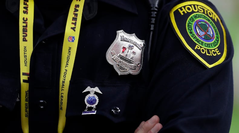 A Houston police officer guards outside NRG Stadium before the NFL Super Bowl 51 football game between the Atlanta Falcons and the New England Patriots Sunday, Feb. 5, 2017, in Houston. (AP Photo/Eric Gay)