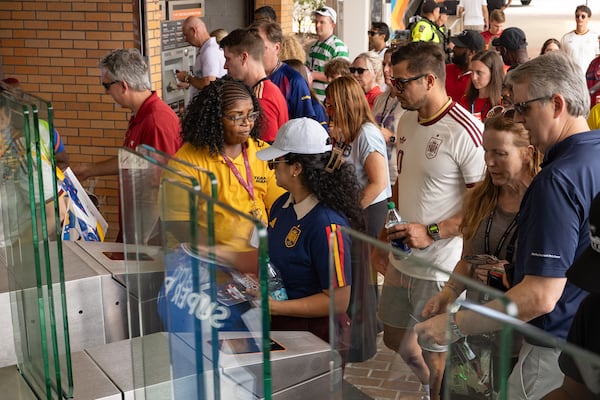 A MARTA employee helps fans access the Vine City station as fans commute to attend the FIFA World Cup match in Atlanta on Monday, June 15, 2026. (Ben Hendren for the AJC)