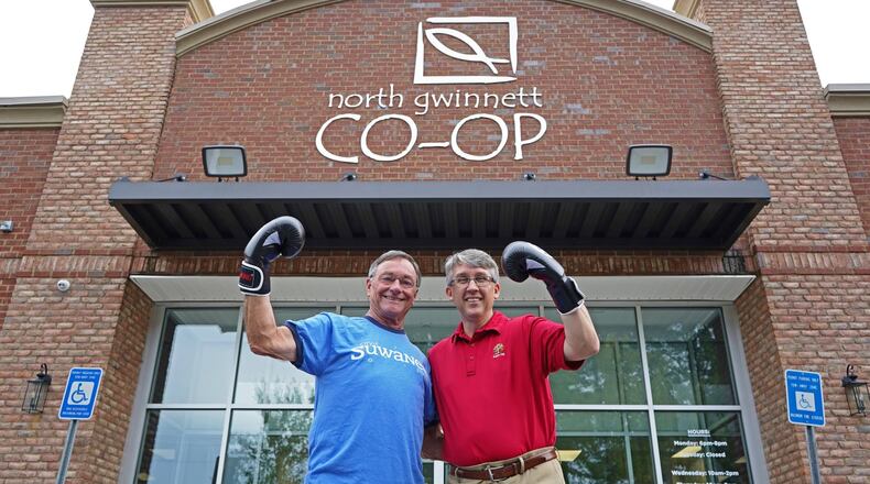 Suwanee Mayor Jimmy Burnette and Sugar Hill Mayor Brandon Hembree put on their boxing gloves for a friendly "food fight" to raise donations for the North Gwinnett Co-op. (Courtesy City of Suwanee)