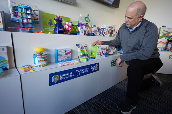 Rick Woldenberg, CEO of Learning Resources, an educational toy company, looks at products manufactured in China, at a showroom in Vernon Hills, Ill., Friday, April 11, 2025. (AP Photo/Nam Y. Huh)