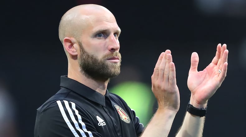 Atlanta United interim head coach Rob Valentino applauds his team and the fans after a 1-0 victory over Los Angeles FC during the second half Sunday, Aug. 15, 2021, at Mercedes-Benz Stadium in Atlanta. (Curtis Compton / Curtis.Compton@ajc.com)