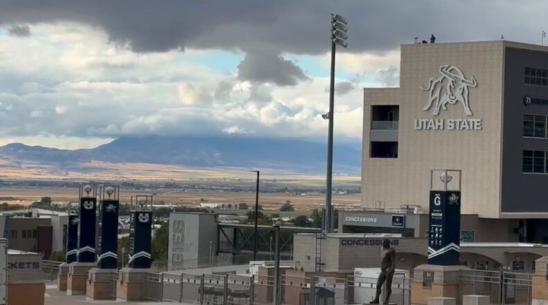 The city of Logan, Utah, a college and dairy farming town, is seen from the hillside on the Utah State University campus, Wednesday, April 22, 2026. (AP Photo/Hannah Schoenbaum)