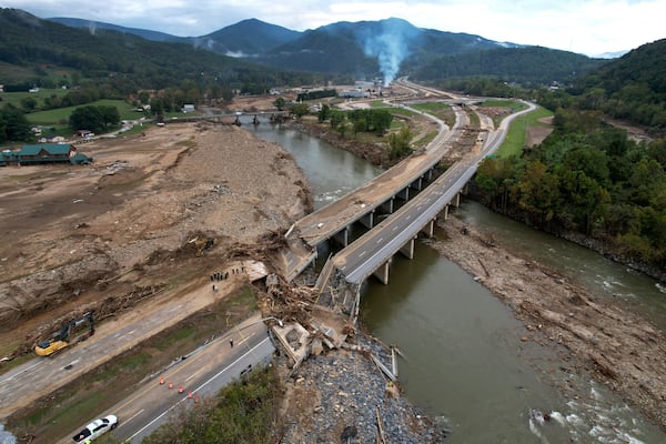 FILE - A bridge along Interstate 26 is destroyed in the aftermath of Hurricane Helene, Oct. 4, 2024, in Erwin, Tenn. (AP Photo/Jeff Roberson, File)