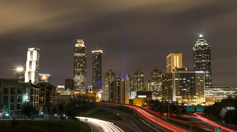 SECONDARY PHOTO - Dec. 24, 2015 Atlanta:  Flood warnings and watches were in effect for large areas of metro Atlanta and north Georgia after a Christmas Eve weather system that spawned deadly tornadoes in Mississippi, Tennessee and Arkansas moved through the area Thursday. Downed trees were reported in parts of metro Atlanta, and Georgia Power reported nearly 10,000 customers without electricity statewide just before 9 a.m. The rough weather was also causing departure delays averaging 45 minutes to an hour at Hartsfield-Jackson International Airport. The weather system spawned two dozen tornadoes in six states from Indiana and Illinois to the Deep South, killing three people in Mississippi, two in Tennessee and one in Arkansas. The wet and windy weather was causing other problems, from interstate crashes, which left a HERO worker injured, to downed trees in Buckhead and elsewhere in metro Atlanta. A flash flood warning was posted for southwestern Fulton County, southeastern Cobb Count, eastern Douglas County, northwestern Clayton County and all of DeKalb County, as another area of heavy rain began to enter the southern metro area. All of north Georgia was under a flood watch through Friday night, with forecasters predicting an additional 1 to 3 inches of rain. JOHN SPINK /JSPINK@AJC.COM