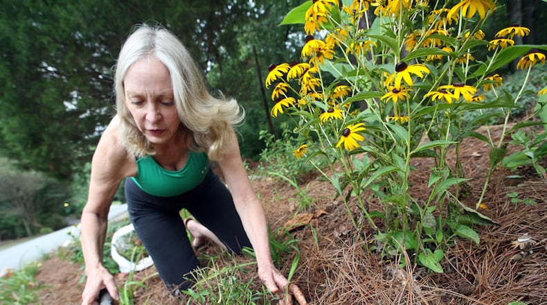 Nell Jones transplants perennials at her son's Sandy Springs home. She still wonders, she said, how it was that Mark Barton's bullet missed her that day. The experience "reminded me how small and insignificant we all are on the big scale."