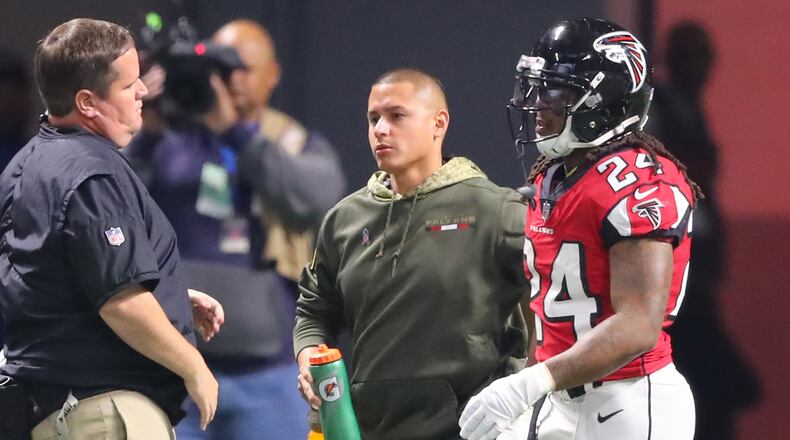 Falcons trainers assist running back Devonta Freeman as he leaves the game during the first quarter against the Cowboys in a NFL football game on Sunday, November 12, 2017, in Atlanta.    Curtis Compton/ccompton@ajc.com