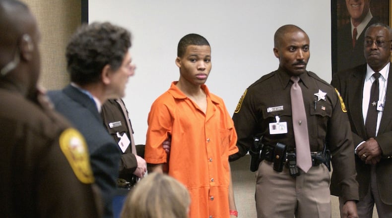 Lee Boyd Malvo is brought to court in Virginia Beach Oct. 22, 2003, to be identified by a witness during the capital murder trial of John Allen Muhammad. Malvo, then 17, and Muhammad, who was 41, were known as the Beltway snipers, a pair of killers who targeted more than a dozen victims over a three-week span in the fall of 2002, killing 10 people. Malvo, now 33, has been granted a new sentencing hearing in four Virginia slayings for which he was sentenced to life without parole.