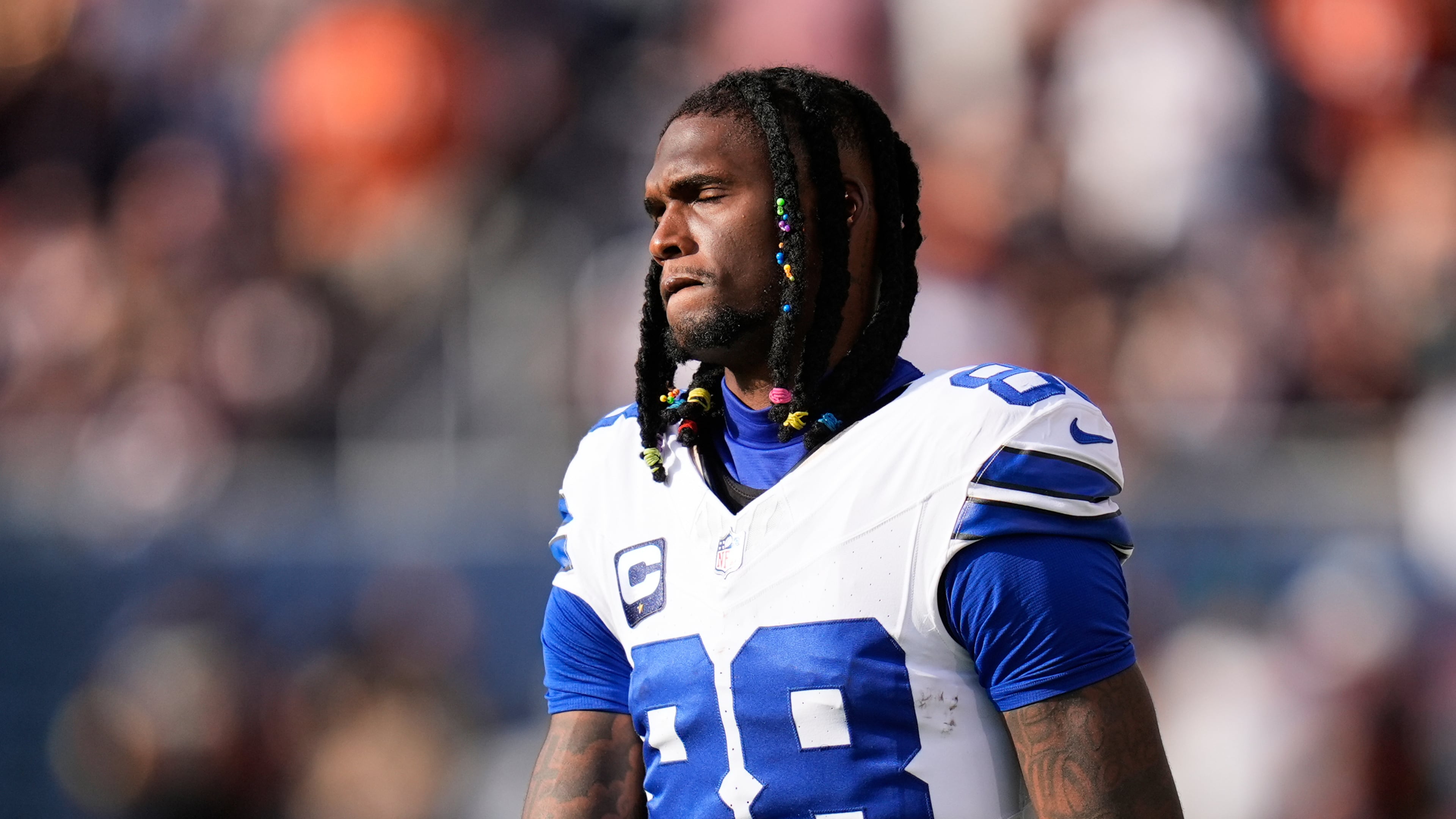Dallas Cowboys wide receiver CeeDee Lamb walks along the sideline after suffering an unknown injury in the first half of an NFL football game against the Chicago Bears Sunday, Sept. 21, 2025, in Chicago. (AP Photo/Erin Hooley)