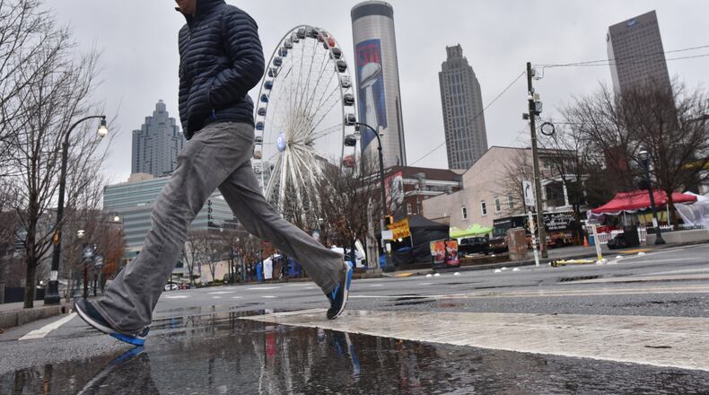 A spritz of rain blanketed Atlanta on Tuesday instead of a repeat of "Snowpocalypse," the storm that brought snow, ice and ridicule to the region in 2014. HYOSUB SHIN / HSHIN@AJC.COM