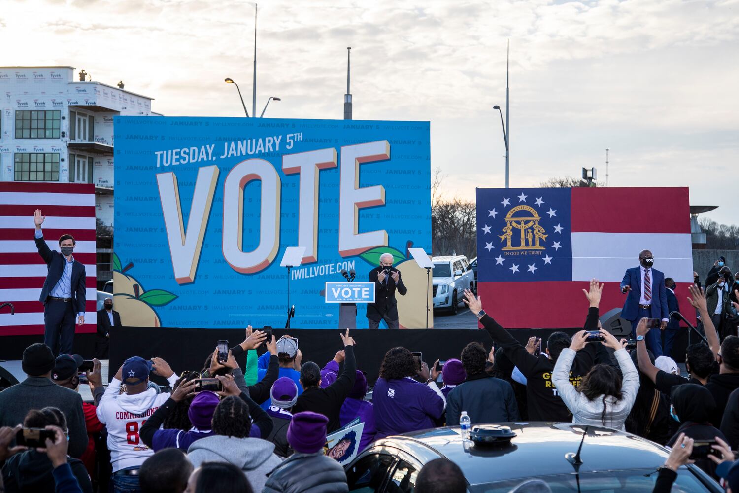 01/04/2021 — Atlanta, Georgia — US Senate Democrat candidates Jon Ossoff (left) and Rev. Raphael Warnock (right) join the stage with President-elect Joe Biden (center) following his remarks during a campaign rally in Atlanta’s Summerhill neighborhood, Monday, January 4, 2021. (Alyssa Pointer / Alyssa.Pointer@ajc.com)