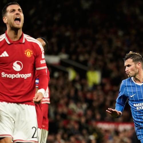 Brighton's Pascal Gross, right, celebrates after scoring his side's second goal during the English League Cup third round soccer match between Manchester United and Brighton and Hove Albion in Manchester, England, Wednesday, Sept. 16, 2026. (AP Photo/Dave Thompson)