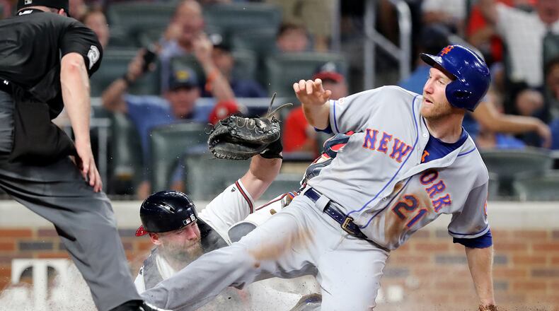 August 13, 2019 Atlanta: Atlanta Braves catcher Brian McCann tags New York Mets Todd Frazier out at the plate on a throw from Ronald Acuna Jr. during the sixth inning in a MLB baseball game on Tuesday, August 13, 2019, in Atlanta. Curtis Compton/ccompton@ajc.com