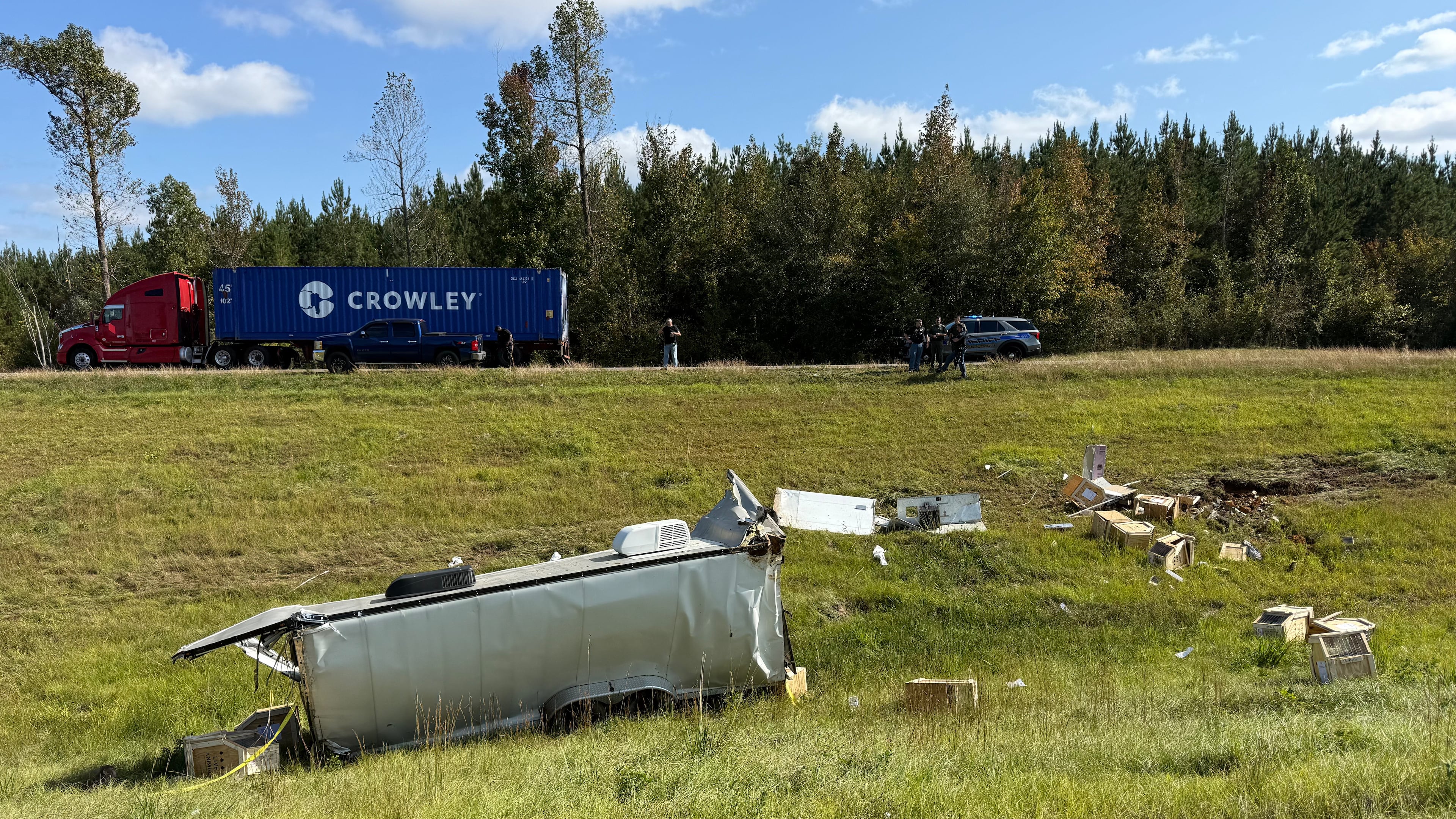 This photo provided by Scotty Ray Boyd shows an overturned truck which had been transporting several monkeys, Tuesday, Oct. 28, 2025, in Heidelberg, Miss. (Scotty Ray Boyd via AP)