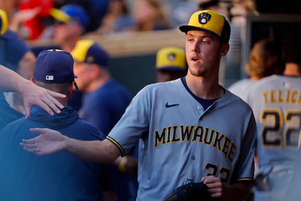 Milwaukee Brewers starting pitcher Jacob Misiorowski (32) returns to the dugout after throwing against the Minnesota Twins in the third inning of a baseball game Friday, June 20, 2025, in Minneapolis. (AP Photo/Bruce Kluckhohn)